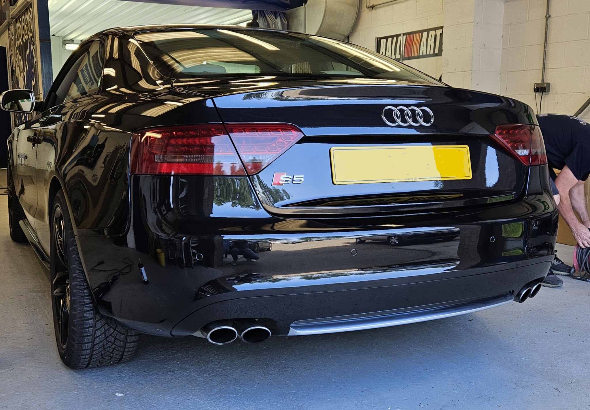 Black Audi S5 seen from the rear, finished in the workshop